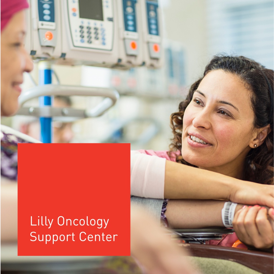 Patient and caregiver discussing lilly oncology support center